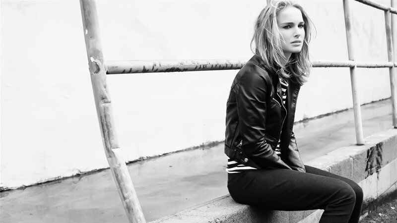 woman in leather jacket sitting