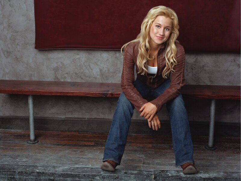 woman in leather jacket sitting