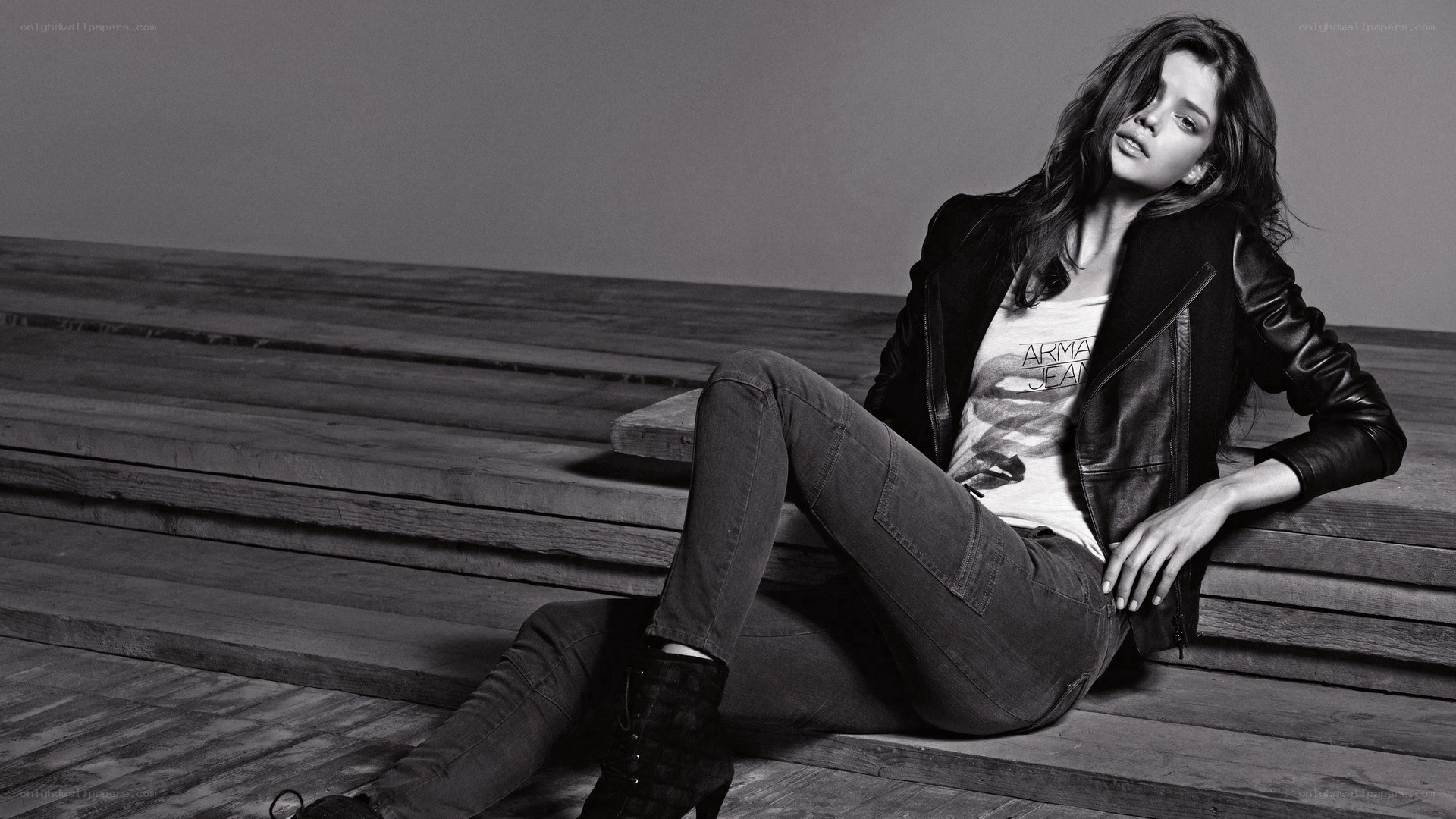 woman in leather jacket sitting