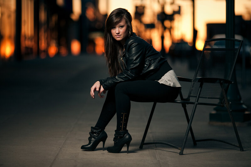 woman in leather jacket sitting