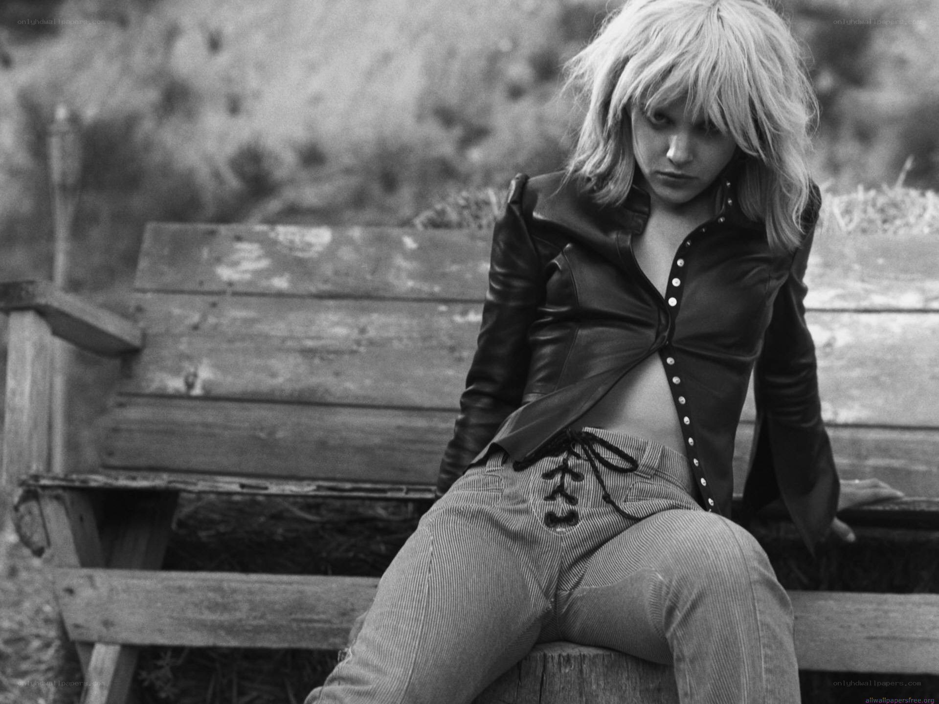 woman in leather jacket sitting