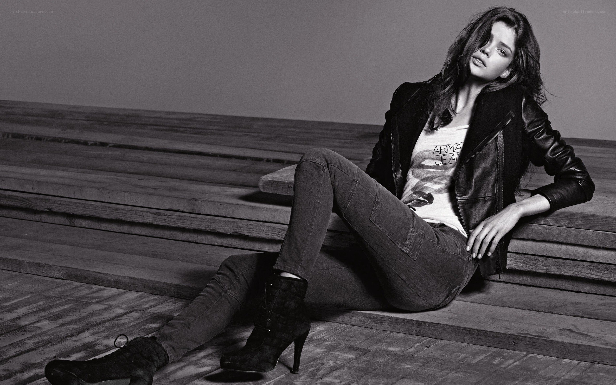 woman in leather jacket sitting