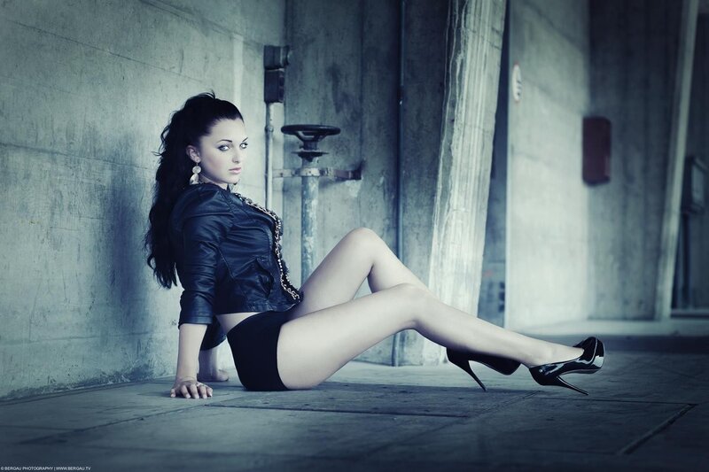 woman in leather jacket sitting