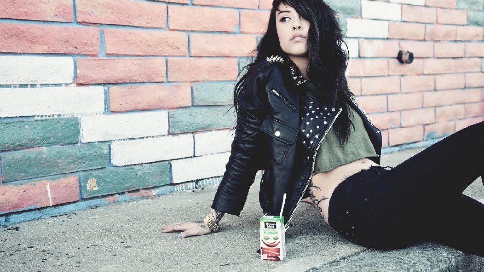 woman in leather jacket sitting