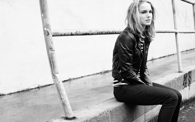 woman in leather jacket sitting