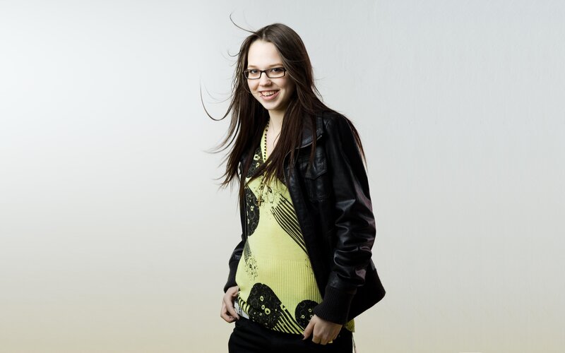 woman in leather jacket smiling