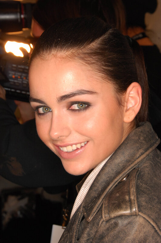 woman in leather jacket smiling
