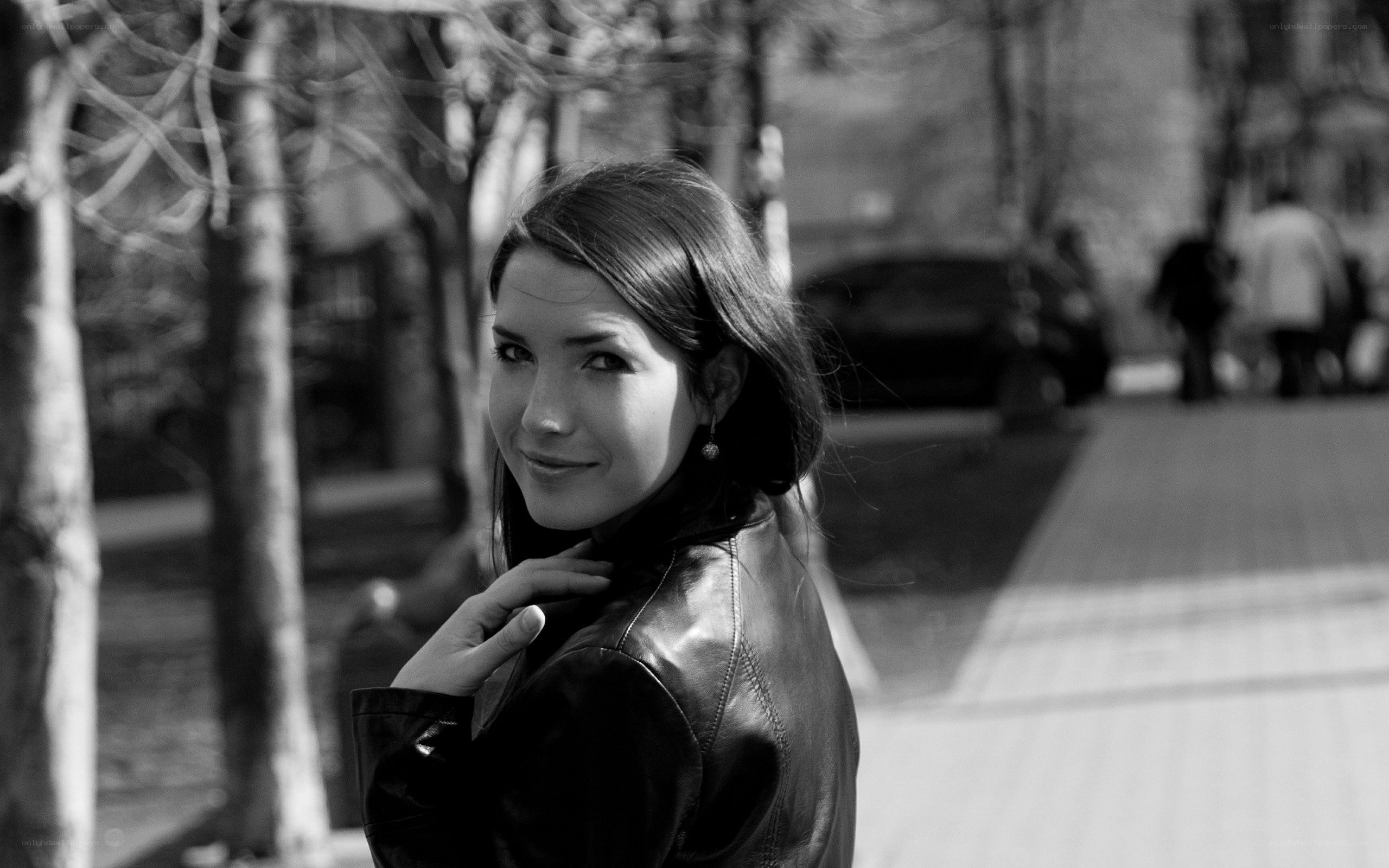 woman in leather jacket smiling