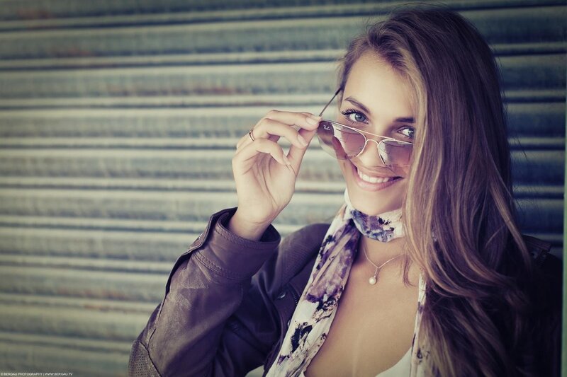 woman in leather jacket smiling