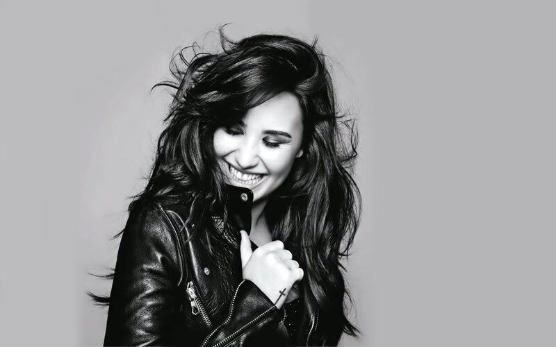 woman in leather jacket smiling