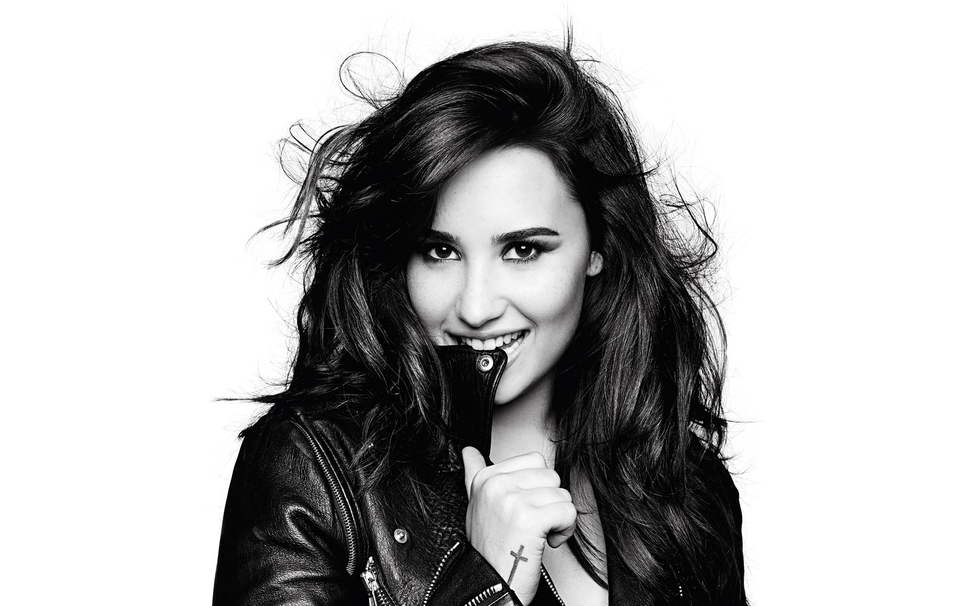 woman in leather jacket smiling