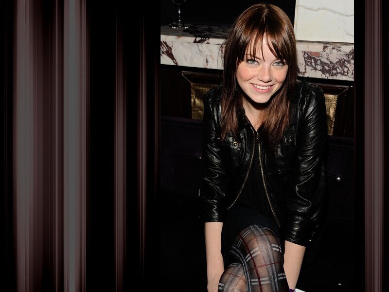 woman in leather jacket smiling
