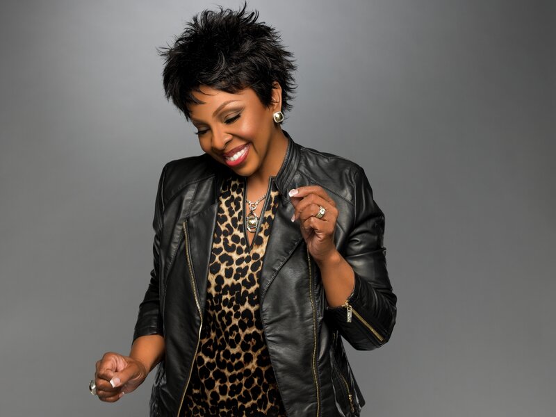 woman in leather jacket smiling