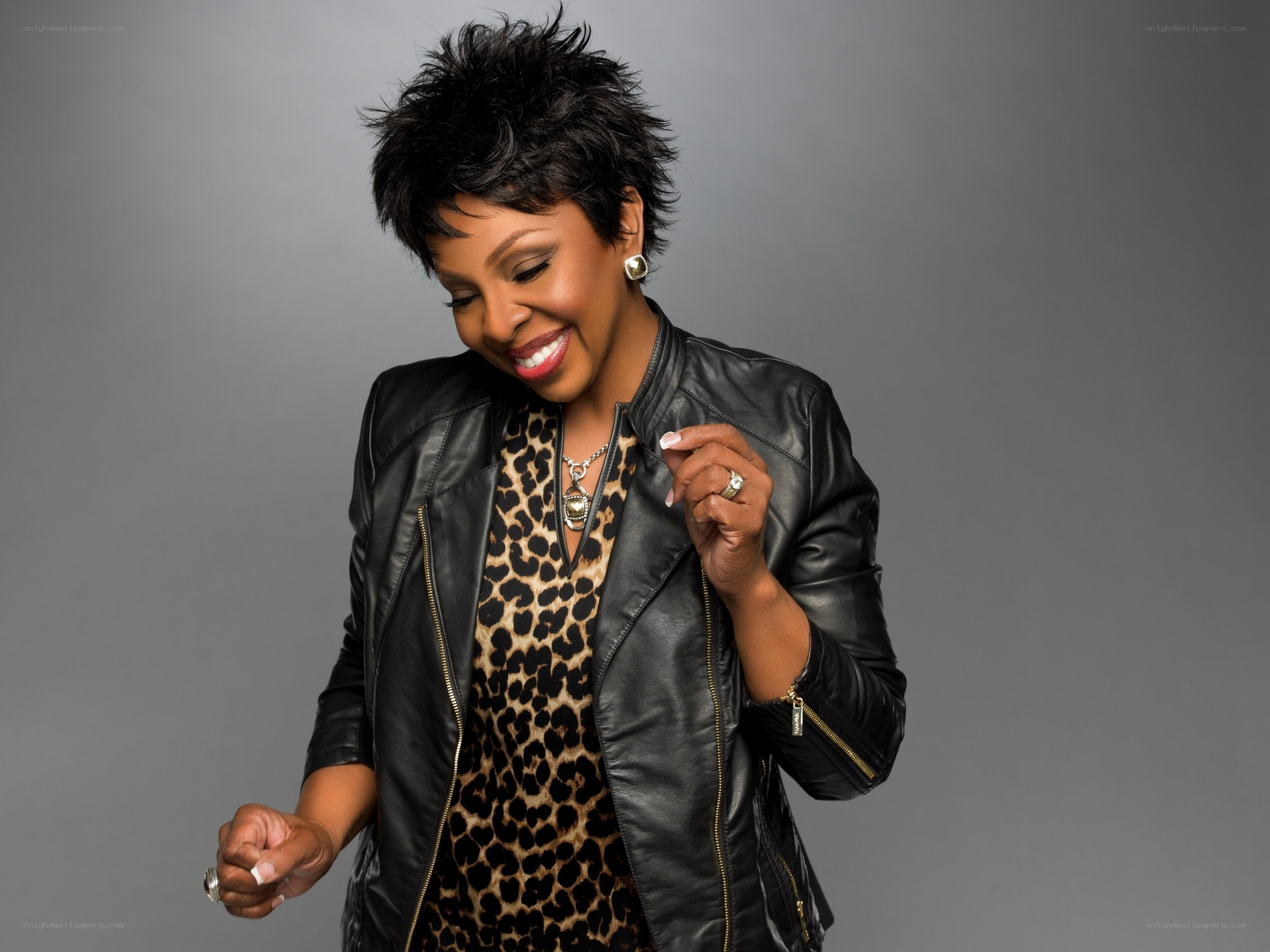 woman in leather jacket smiling