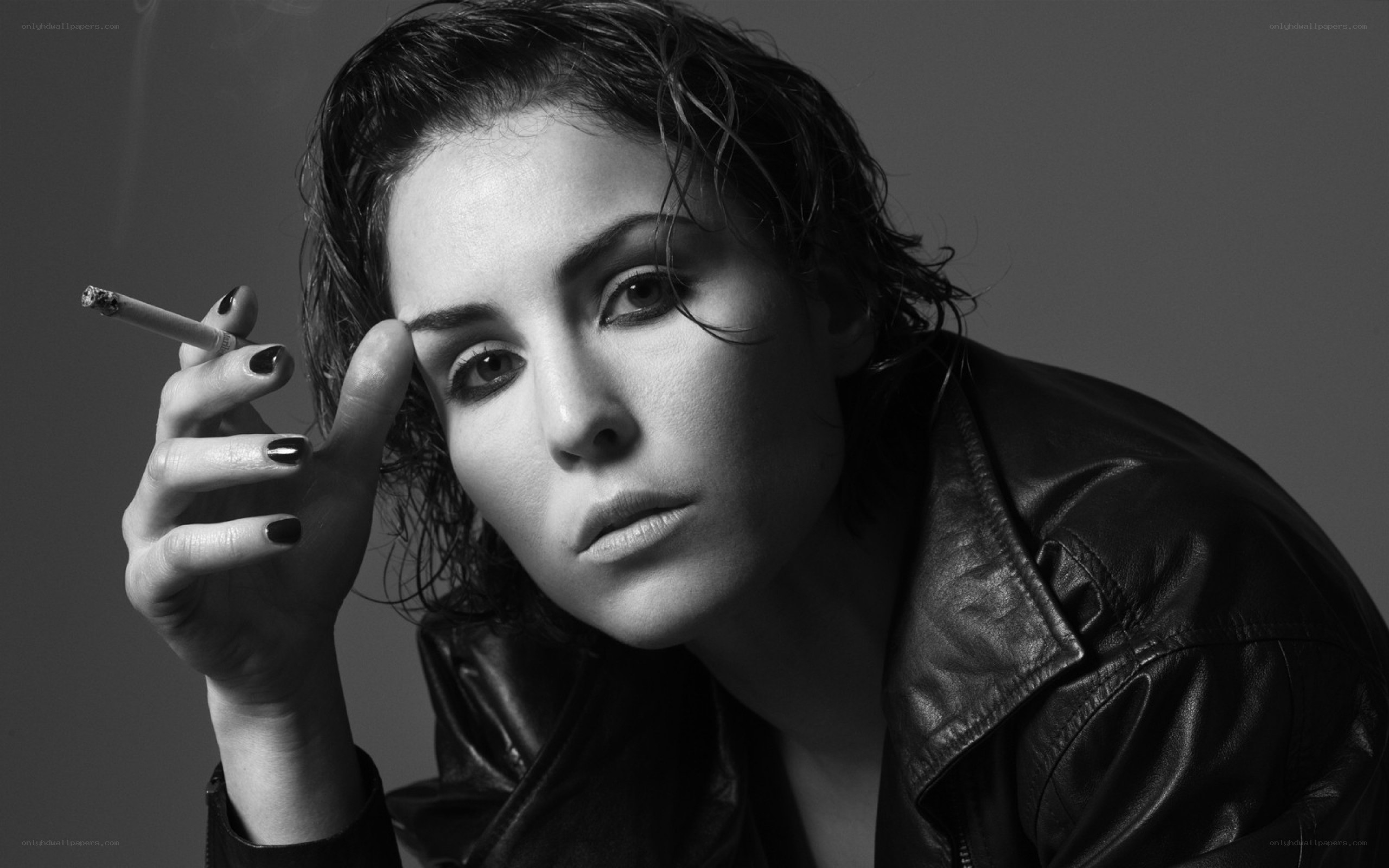 woman in leather jacket smoking
