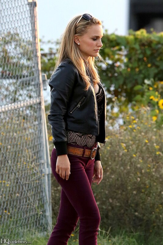 woman in leather jacket walking
