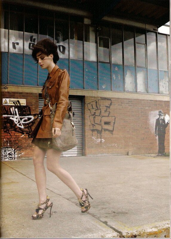 woman in leather jacket walking