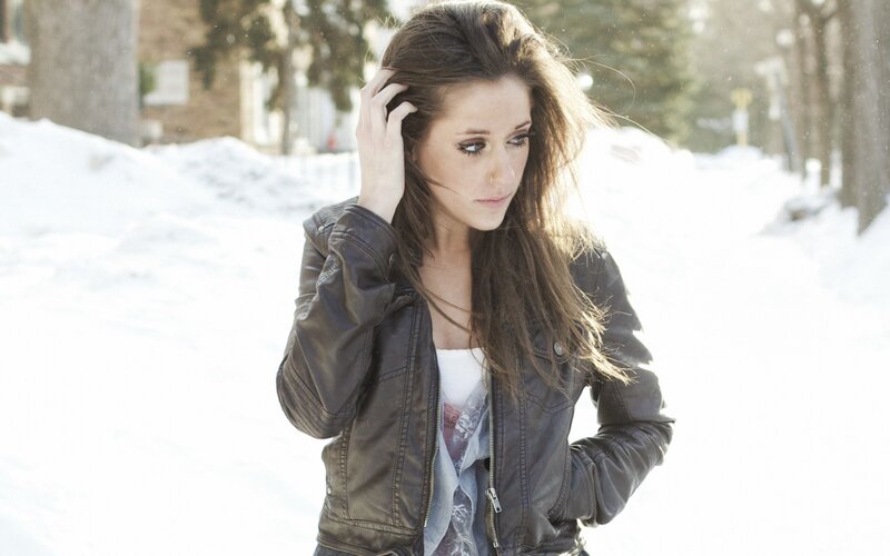 Woman in Leather Jacket — White, Contemplative