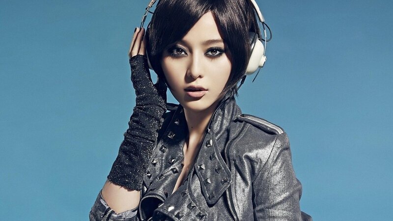 woman in leather jacket with headphones