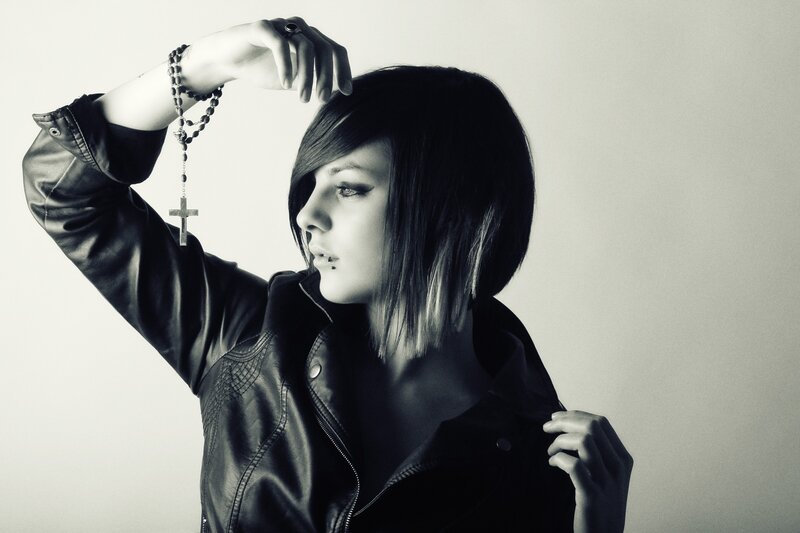 woman in leather jacket with rosary