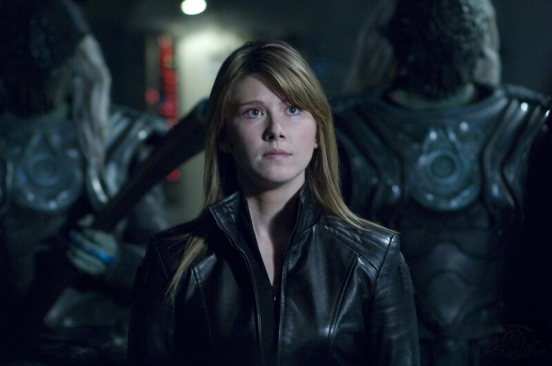 woman in leather jacket with soldiers