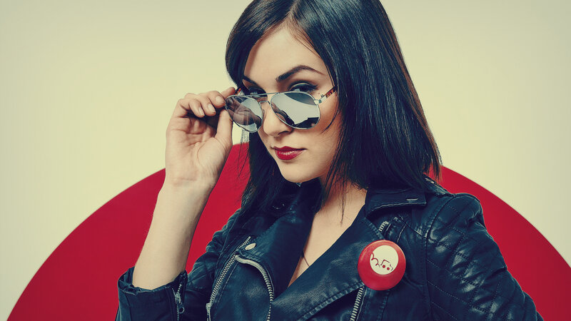woman in leather jacket with sunglasses