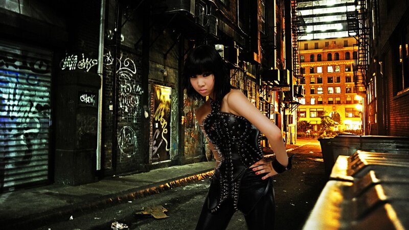 woman in leather outfit on alley