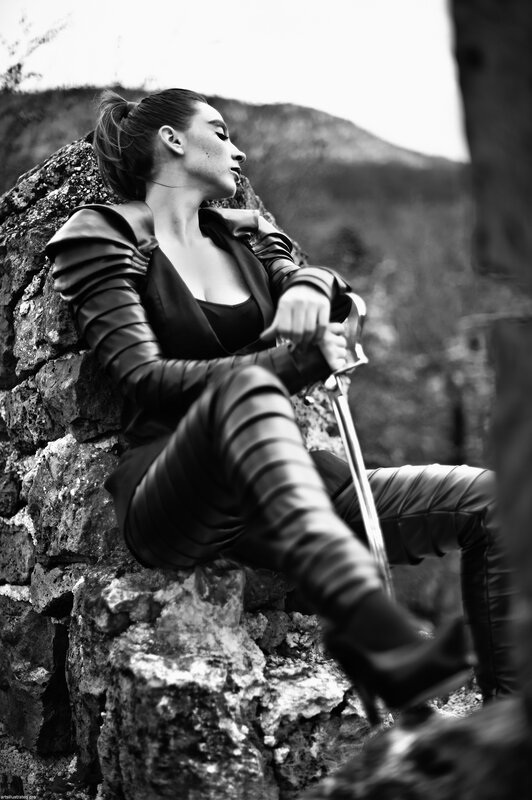 woman in leather outfit with sword