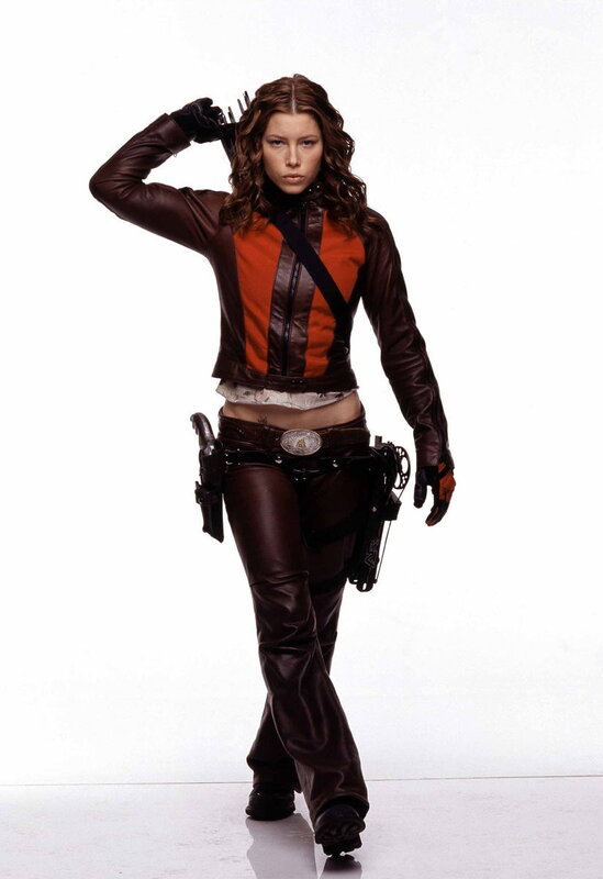 woman in leather outfit with weapons