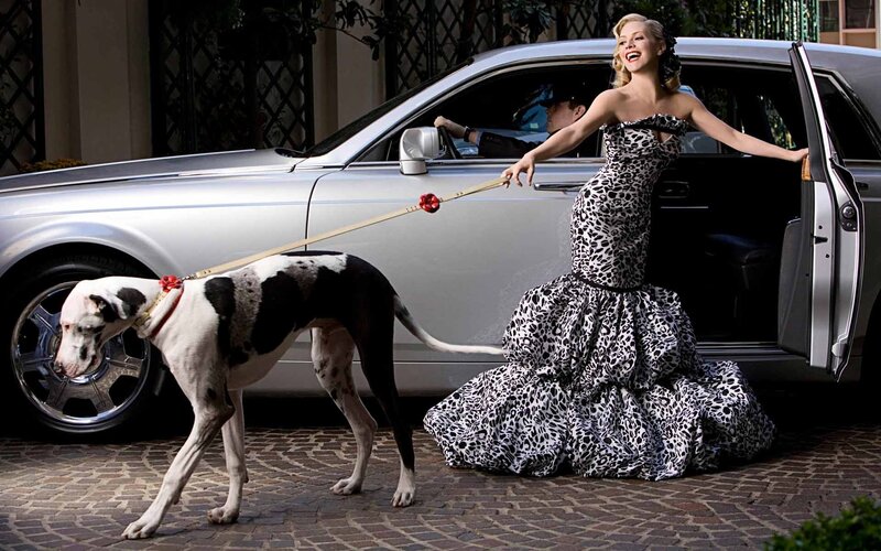 Woman in leopard dress with dog