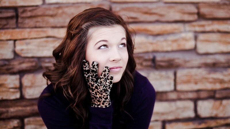woman in leopard gloves