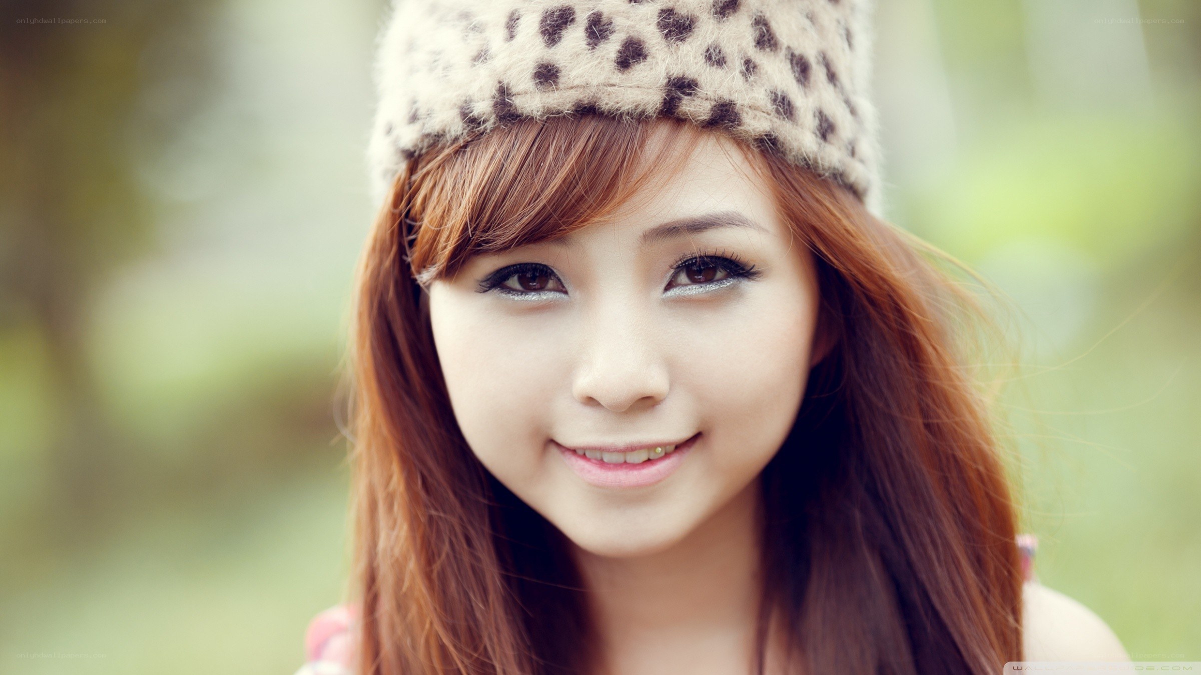 woman in leopard hat smiling