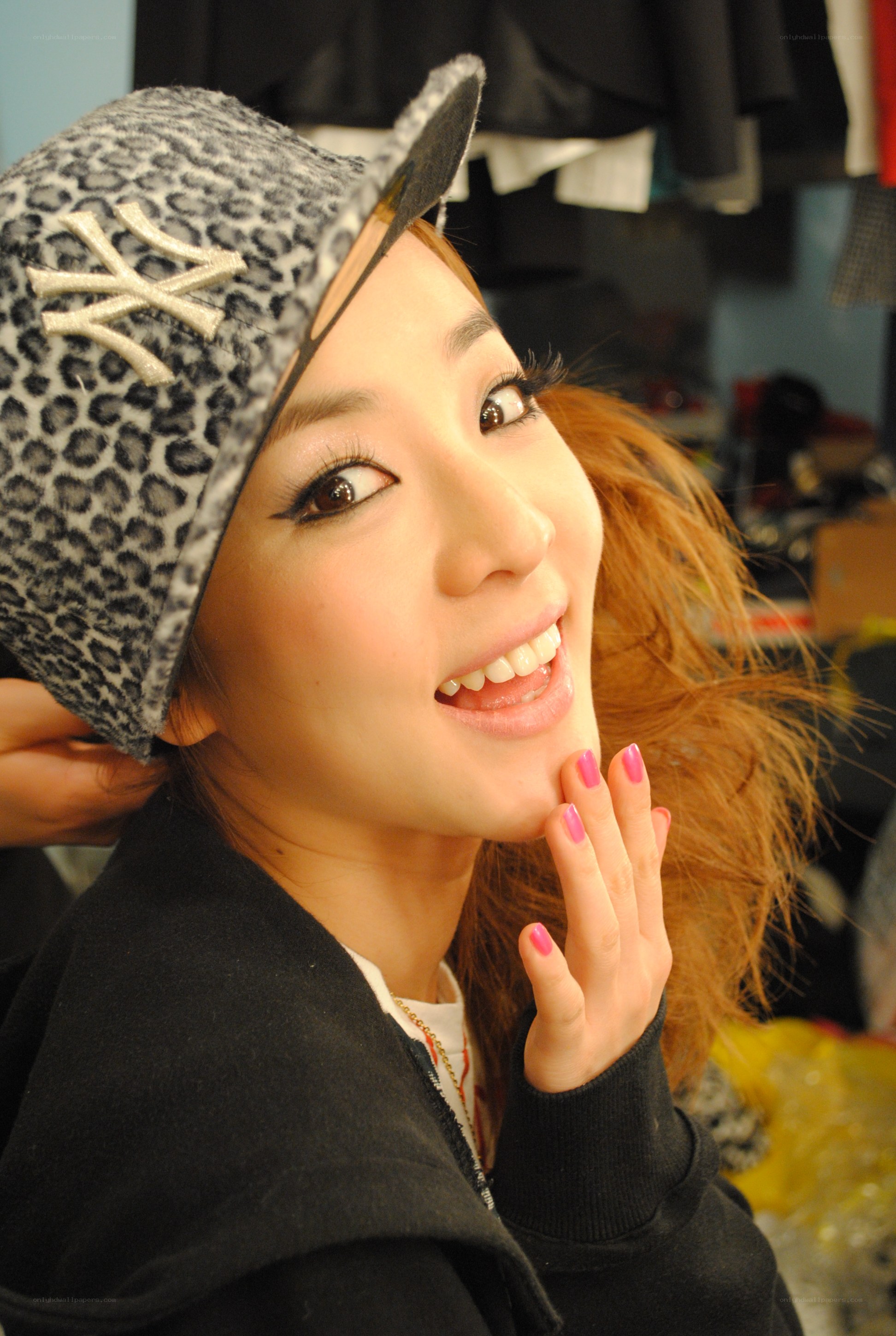 woman in leopard hat smiling