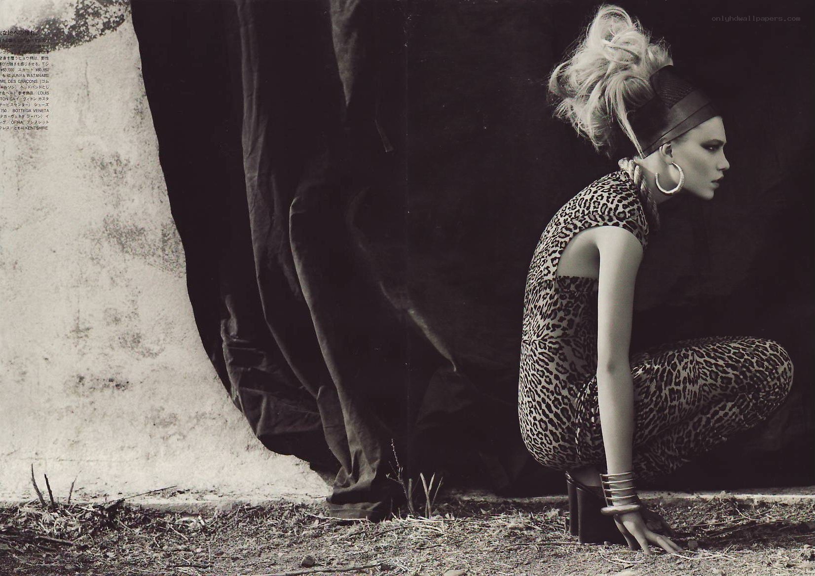 Woman in leopard print crouching
