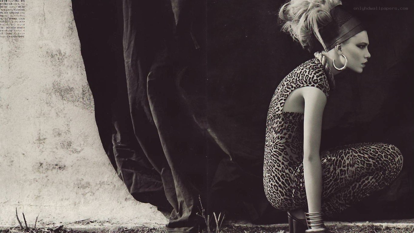 woman in leopard print crouching