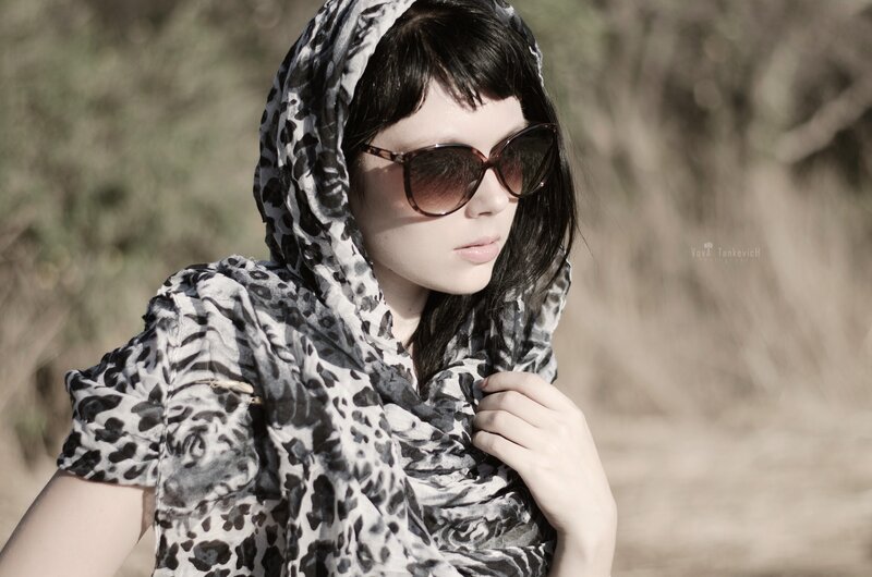 woman in leopard scarf and sunglasses