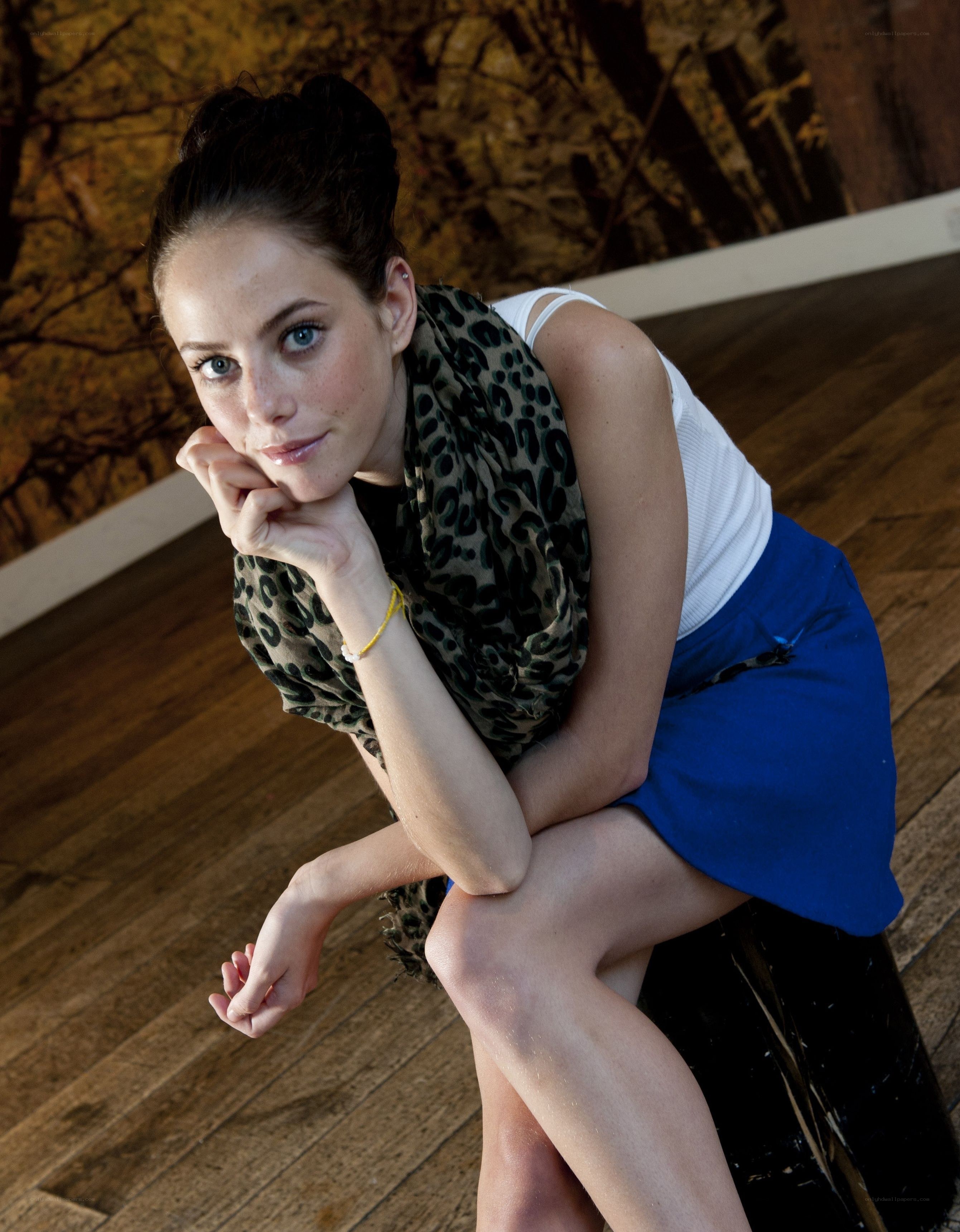 woman in leopard scarf posing