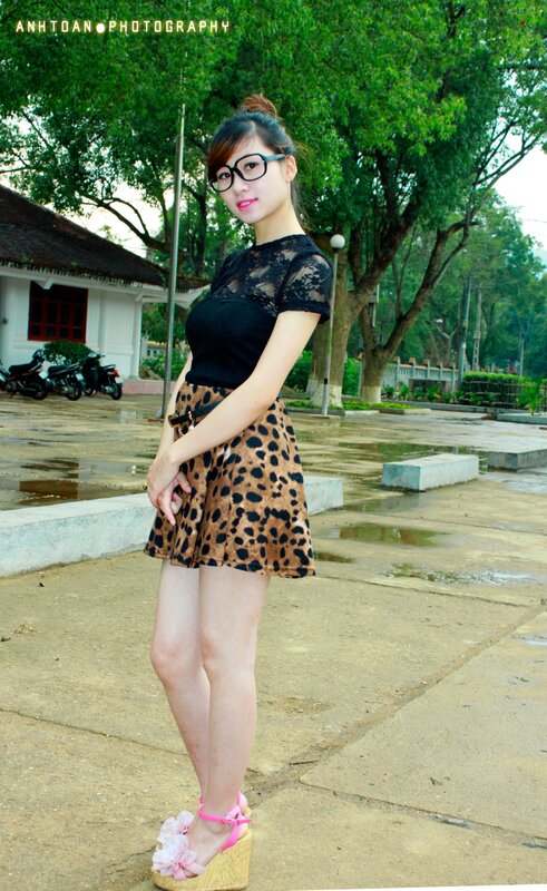 Woman in leopard skirt outdoors