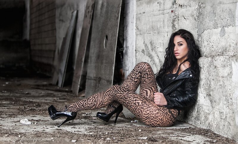 woman in leopard tights sitting