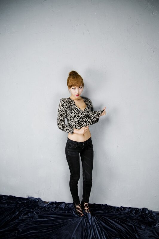 woman in leopard top and jeans