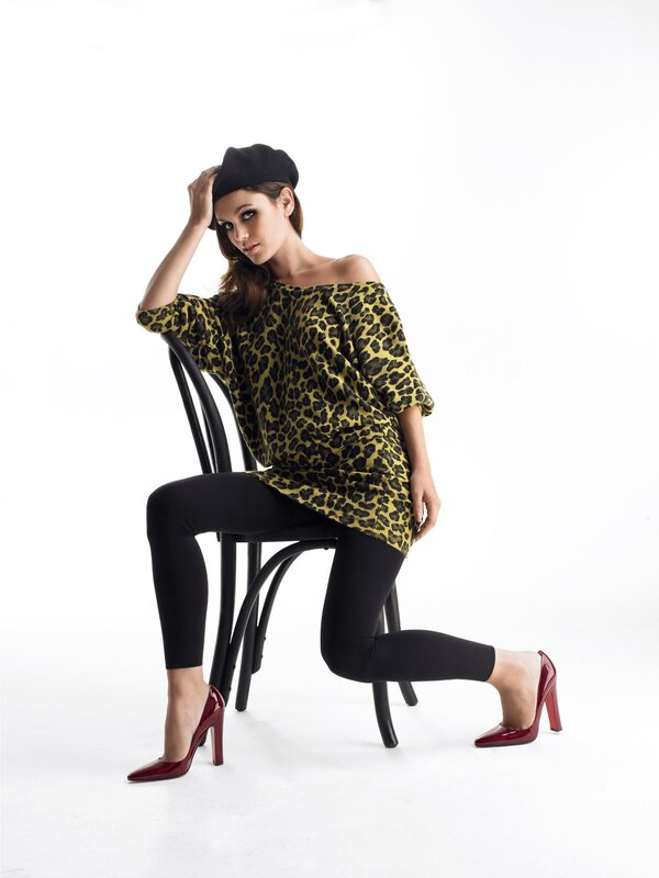 Woman in leopard top and red heels