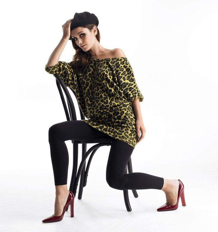 Woman in leopard top and red heels