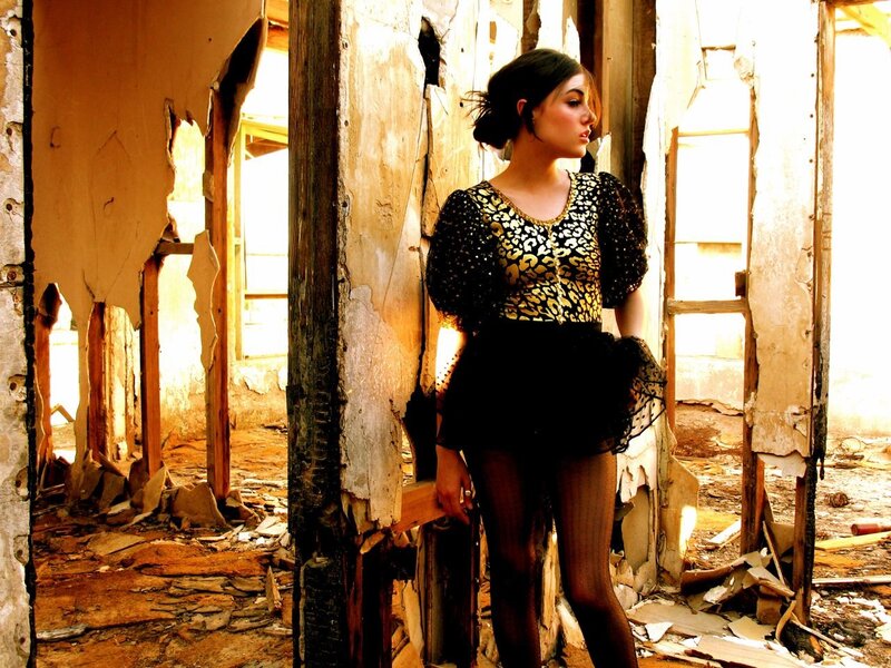woman in leopard top in ruin