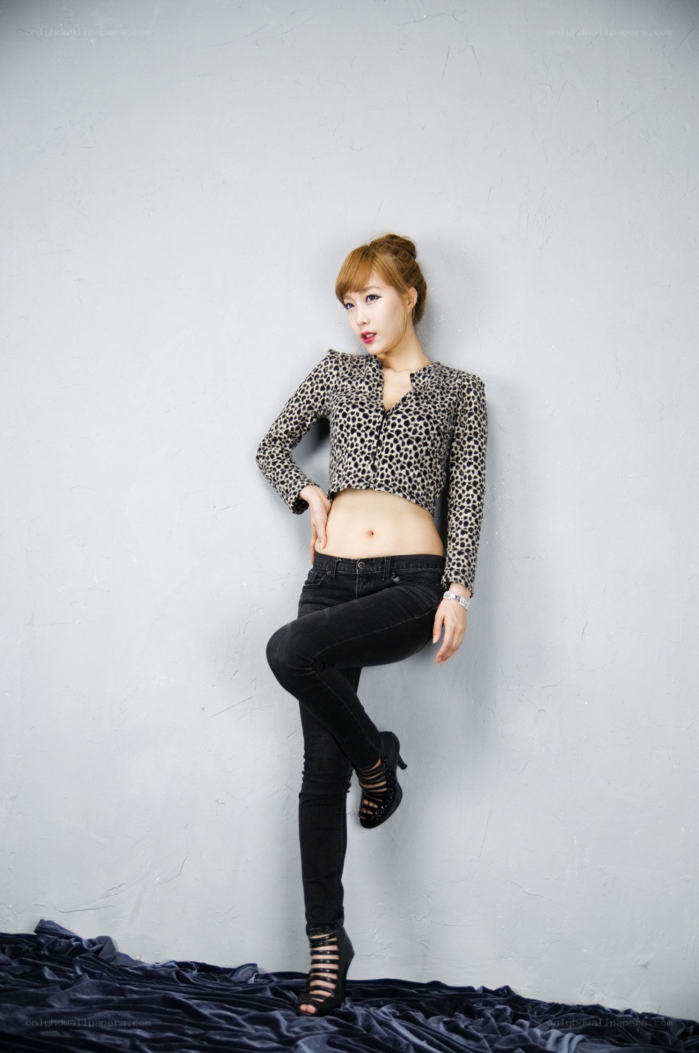 woman in leopard top posing