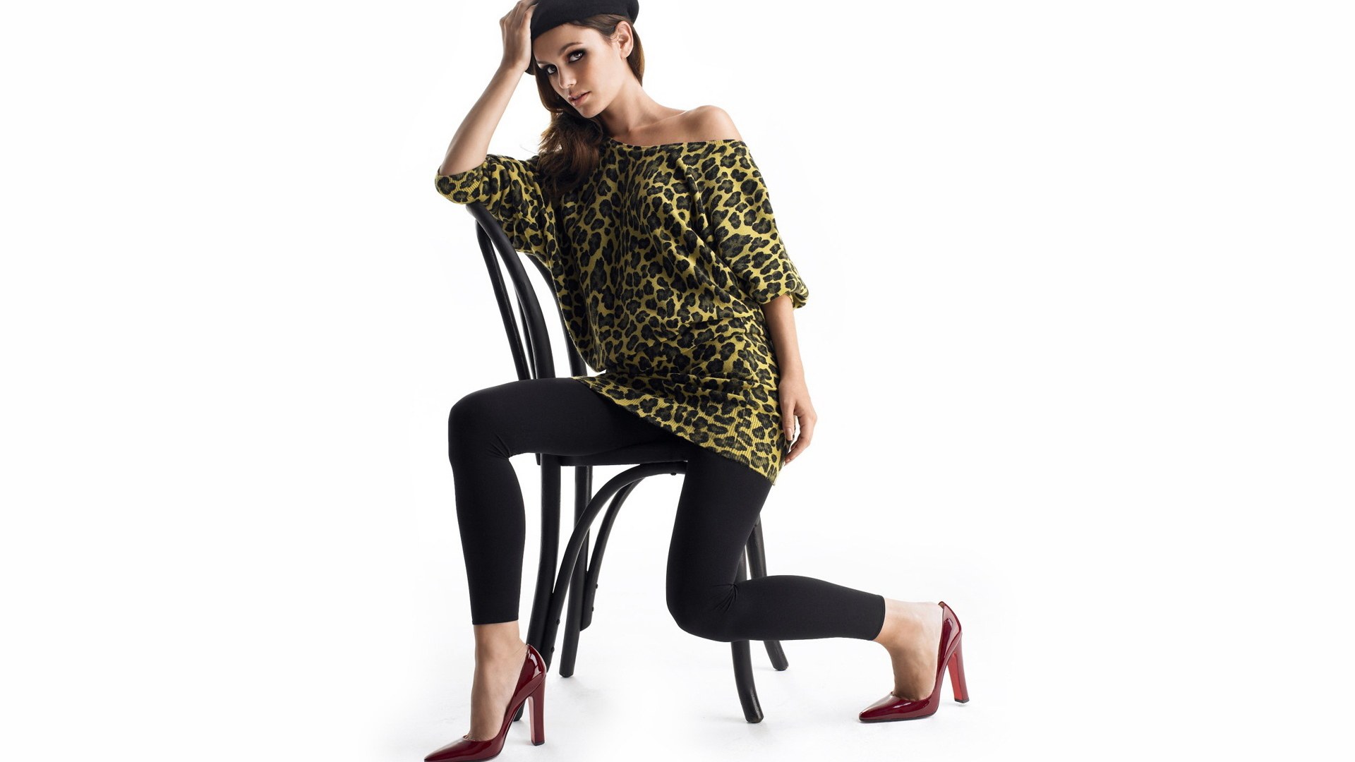 woman in leopard top sitting