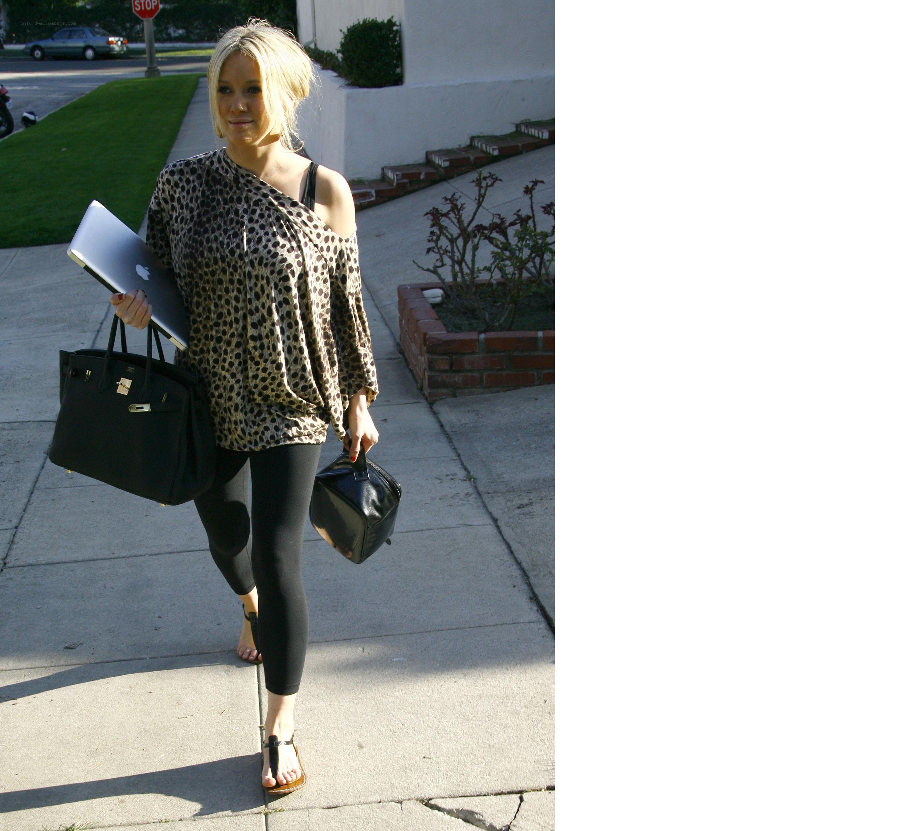 Woman in leopard top walking