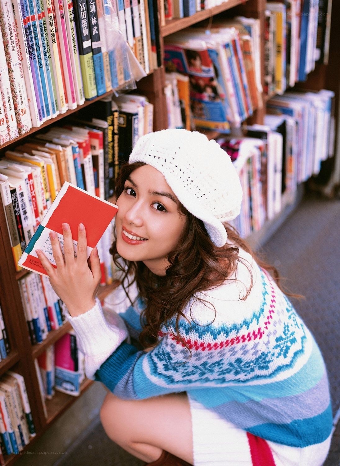 Woman in library with book