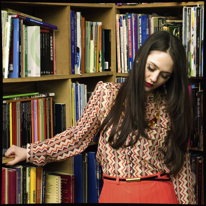 Woman in library with books