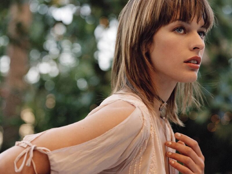 woman in light blouse outdoors