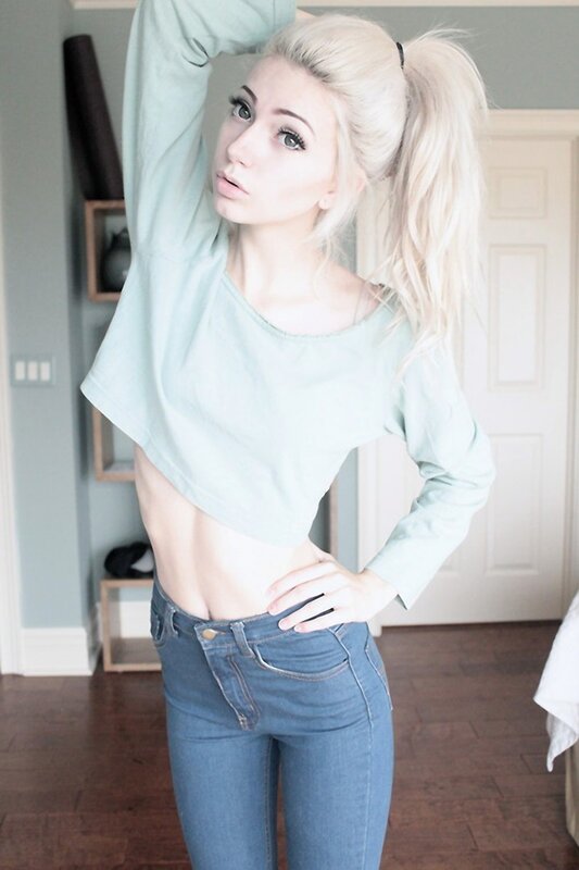 woman in light blue crop top